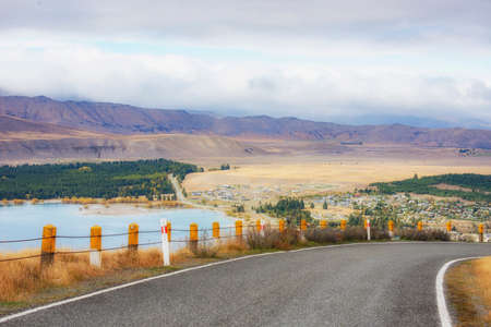 Road on the Mount John Observatory with Lake Tekapo Background in Autumn, New Zealandの写真素材