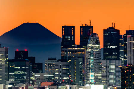 Japan - January 31, 2019 : Illumination of Shinjuku Skyscraper Buildings with Fuji Mountain...