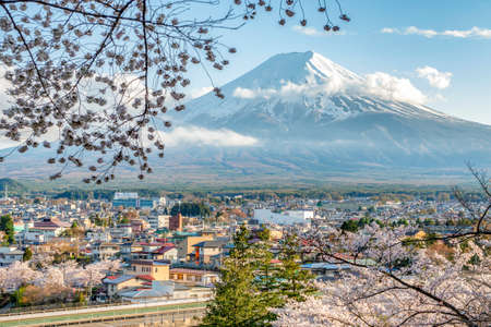 Japan - April 14. 2019 : Cityscape of Fujiyoshida City with Fuji Mountain Background and Cherry Blossom in Springtime, Fujiyoshida, Kawaguchiko, Yamanashiのeditorial素材