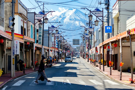 Japan - November 15,, 2019 : Tourists walking across Zebra Crossing at Fuji-Michi Street with Fuji Mountain Background i n Autumn Morning, Fujiyoshida, Yamanashiのeditorial素材