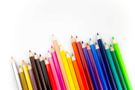 Coloured Pencils on White Paper Backgroundの写真素材