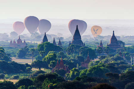 Myanmar - December 4, 2019 : Tourist Sightseeing Balloons flying over Pagoda in the morning, Bagan, Myanmarのeditorial素材
