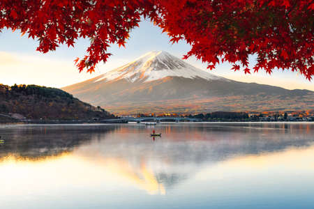 Fuji Mountain Reflection and Red Maple Leaves with Morning Mist in Autumn, Kawaguchiko Lake, Japanの写真素材
