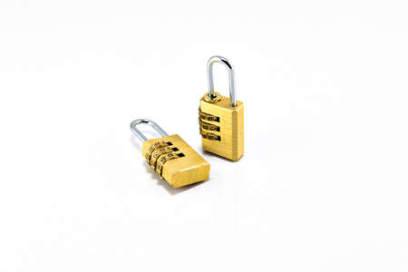 Golden Travel sentry padlock Coded Key on the White Backgroundの写真素材