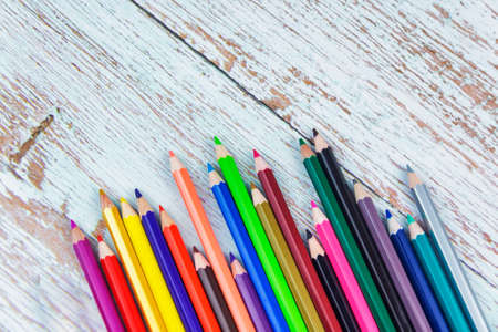 Coloured Penicls on Wooden Table Backgroundの写真素材