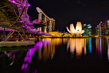 Singapore - August 12, 20122 : Scenic view of Helix Bridge and Marina Bay Sands Hotel Illumination at Night, Marina Bayのeditorial素材