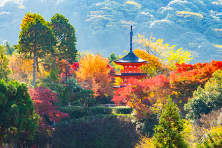 Japan - November 21, 2022 : Scenic landscape of Red Pagoda among colorful maple tree garden in autumn at Kiyomizudera Temple, Kyotoのeditorial素材