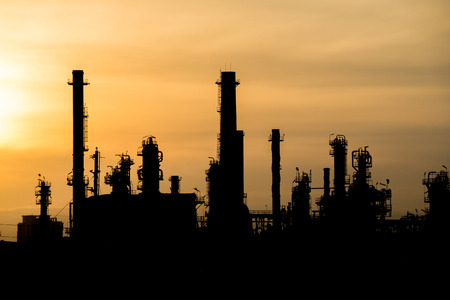 Silhouette of oil Refinery at sunriseの写真素材