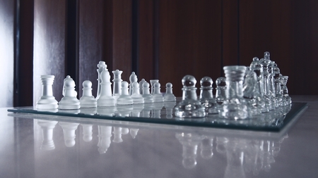 beautiful glassy chessboard and all chessman,color filter and selective focusの写真素材