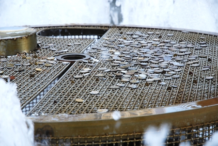 A lot of coins that tourists throw into the fountain of wealthの写真素材