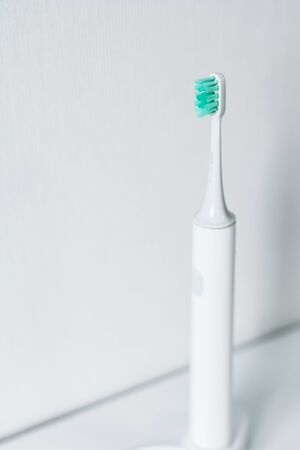 Electric toothbrush on a light background.の写真素材