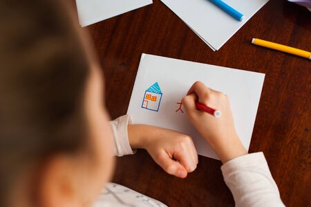 Family drawing and the house attached to the refrigerator