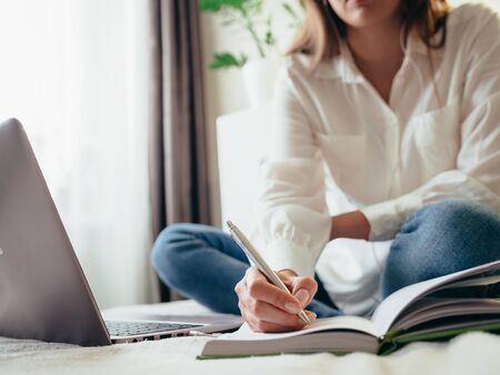 Girl learns, works, self-develops online while sitting at home