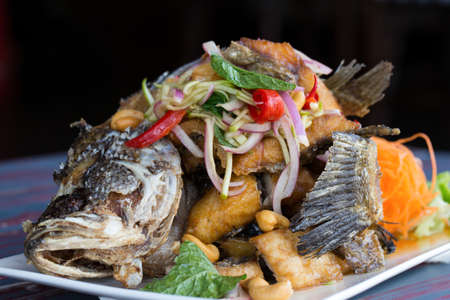 Fired Fish topped with roasted chilli and tamarind sauceの写真素材