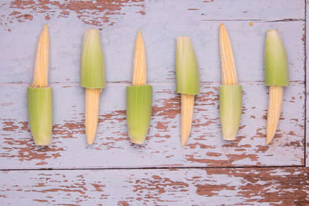 Top View of Baby Corn on wood table backgroundの写真素材