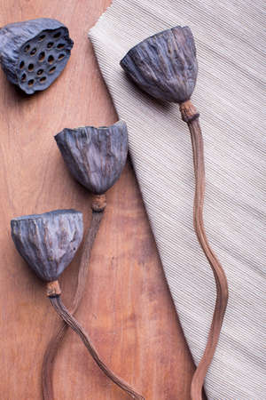 Top view of Dried lotus flowers on wood tableの写真素材