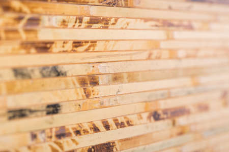 Bamboo wood texture background in light brown tone, selected focusの写真素材