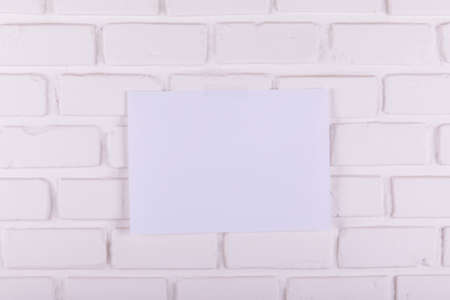 White papers taped on brick wallの写真素材
