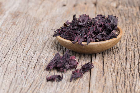 Dried roselle on wooden table, selective focusの写真素材