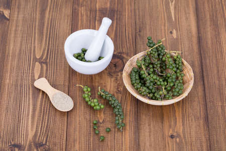 Fresh Black Pepper on wooden backgroundの写真素材