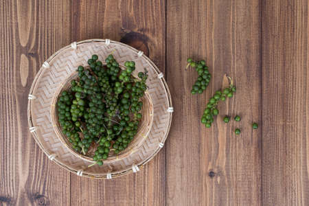 Fresh Black Pepper on wooden backgroundの写真素材