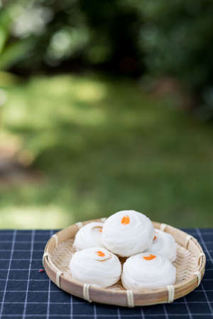 Chinese pastry mung bean with egg yolk (Moon cake), a popular asian dessert on green bokeh backgroundの写真素材