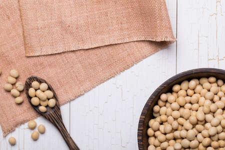 Top view of Soy Bean or Soya Bean on white wooden textured table, food backgroundの写真素材