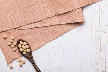 Top view of Soy Bean or Soya Bean on white wooden textured table, food backgroundの写真素材
