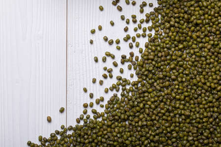 Mung Bean Bean on white wooden textured table, food background with copy spaceの写真素材