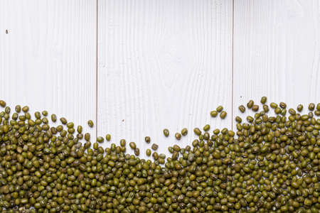 Mung Bean Bean on white wooden textured table, food background with copy spaceの写真素材