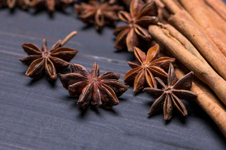 Cinnamon and Star Anise on wooden table with selective focus, food background