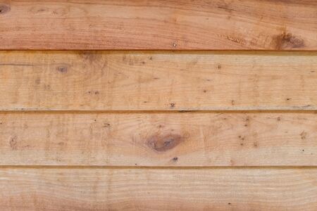 Wood texture background in golden yellow toneの写真素材
