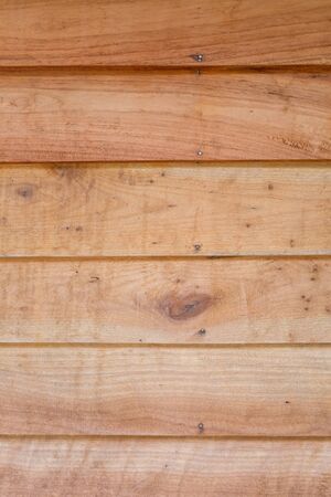 Wood texture background in golden yellow toneの写真素材