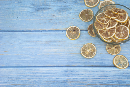 a bowl of sliced dried lemon at the cornerの写真素材