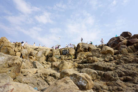 MAKKAH, SAUDI ARABIA - SEPTEMBER, 2016: pilgrims climb Mount Rahmah during the Hajj seasonのeditorial素材