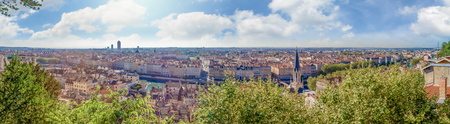 Huge wide Panorama summer view of the city, Lyon, France. With colorful blue sky and white cloudsの写真素材