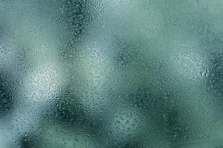 Abstract drop of water on a glassの写真素材
