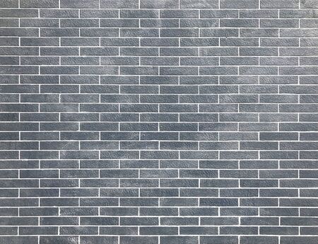 Blue or gray brick wall backgroundの写真素材