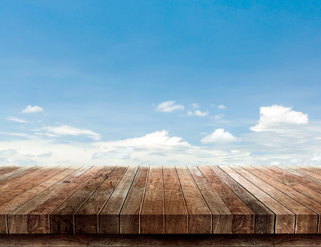 wood shelf on blue sky backgroundの写真素材