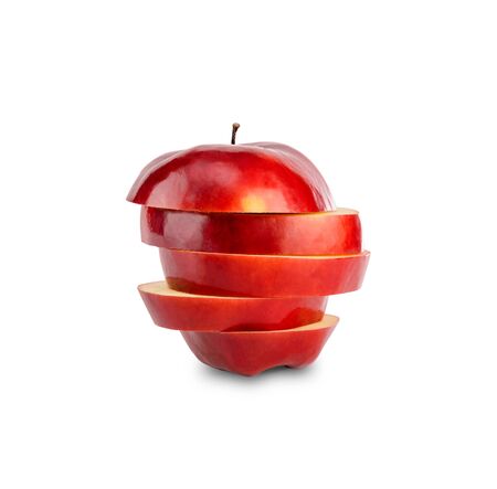Stack of red apple sliced isolated on white backgroundの写真素材