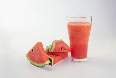 Watermelon smoothie with watermelon slices on white backgroundの写真素材