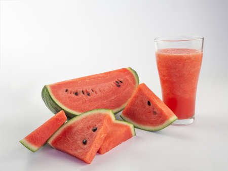 Watermelon smoothie with watermelon slices on white backgroundの写真素材