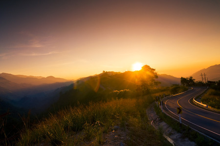 Beautiful sunset road in the countryside mountains landscapeの写真素材