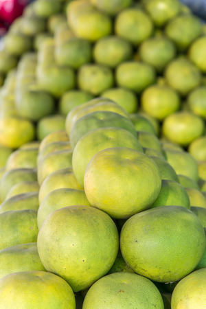 Pomelos on ground, tropical fruit displayed at wholesale fruit market, thailand. The major of thailand's fruitsの写真素材