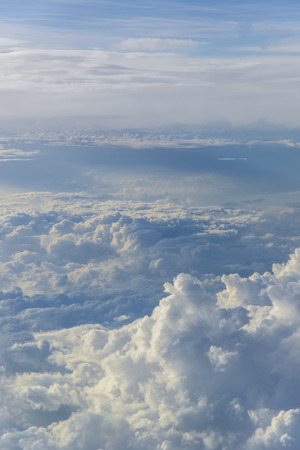 clouds sky sunset. view from the window of an airplane flying in the cloudsの写真素材