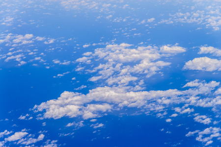 clair blue sky with cloud background from bird eye-view in airplantの写真素材