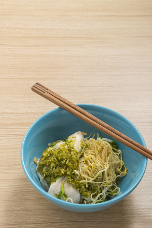 asian noodle, egg noodle with boiled fish and spicy sauce. street food in Thailandの写真素材