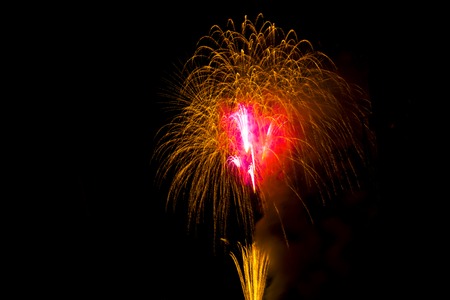 Beautiful colorful firework isolated display for celebration happy new year and merry christmas on backgroundの写真素材