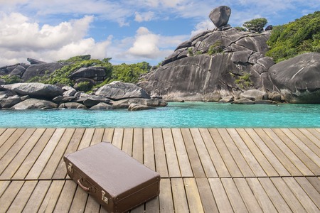 vintage leather luggage on wood  terrace with sea views, Sailing rock of Similan Island, thailand, relax time in vacation,の写真素材