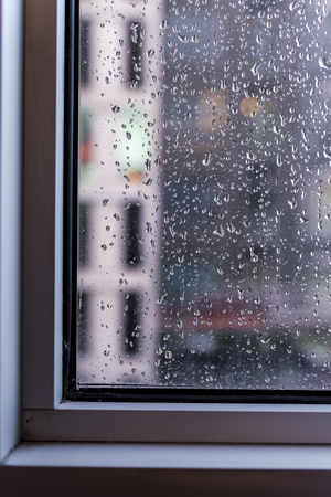Rain / Water drop of rain on glass with outdoor background